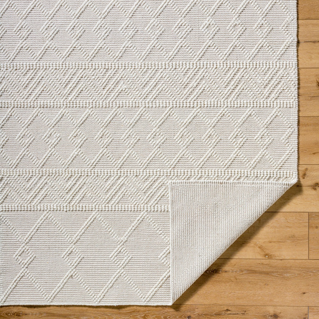 ISHANI Hand-Woven Global Wool Beige Area Rug Fold