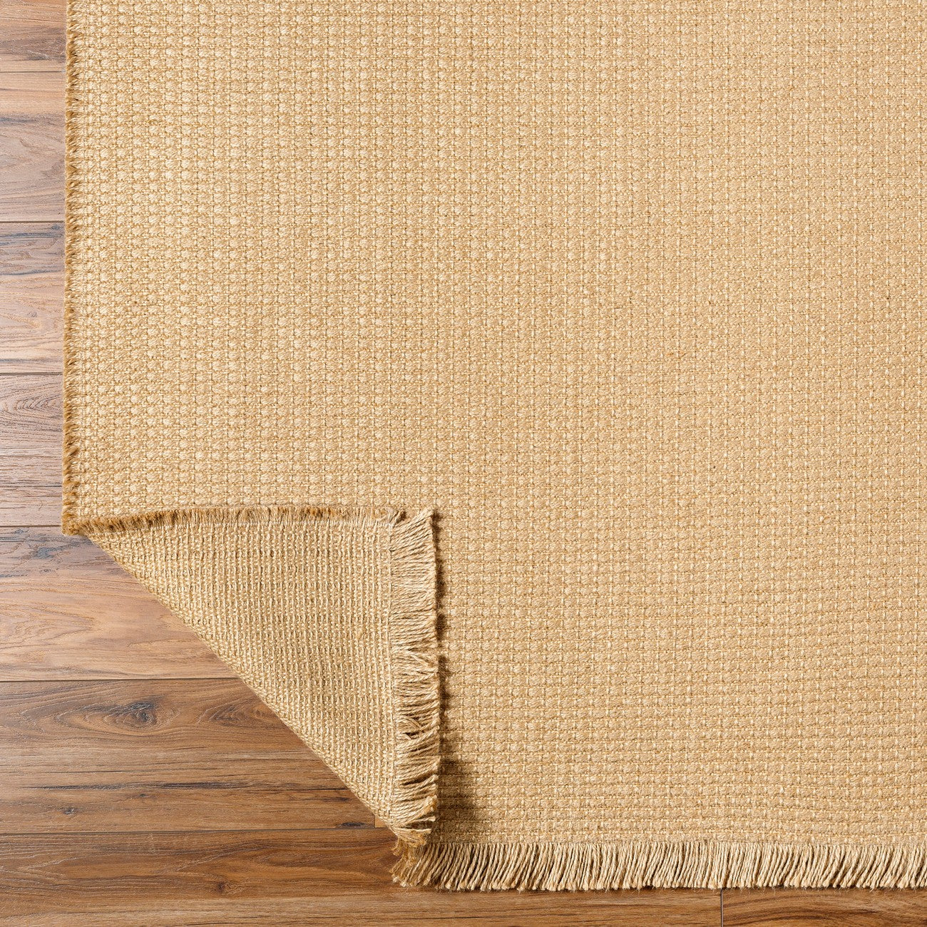 PAVI Becki Owens x Livabliss Solid and Border Camel Jute Area Rug Fold