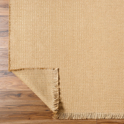 PAVI Becki Owens x Livabliss Solid and Border Camel Jute Area Rug Fold