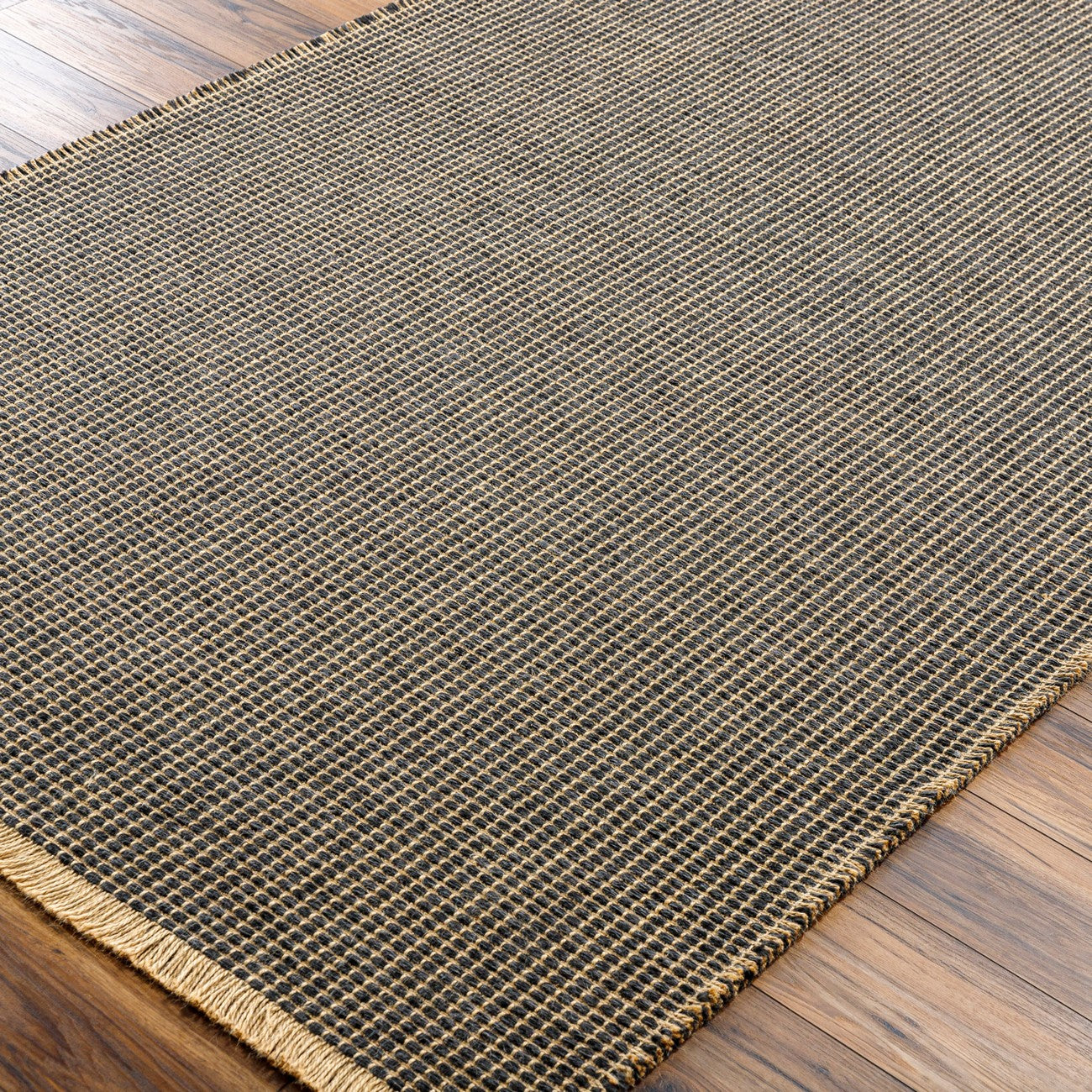 PAVI Becki Owens x Livabliss Solid and Border Charcoal Jute Area Rug Corner