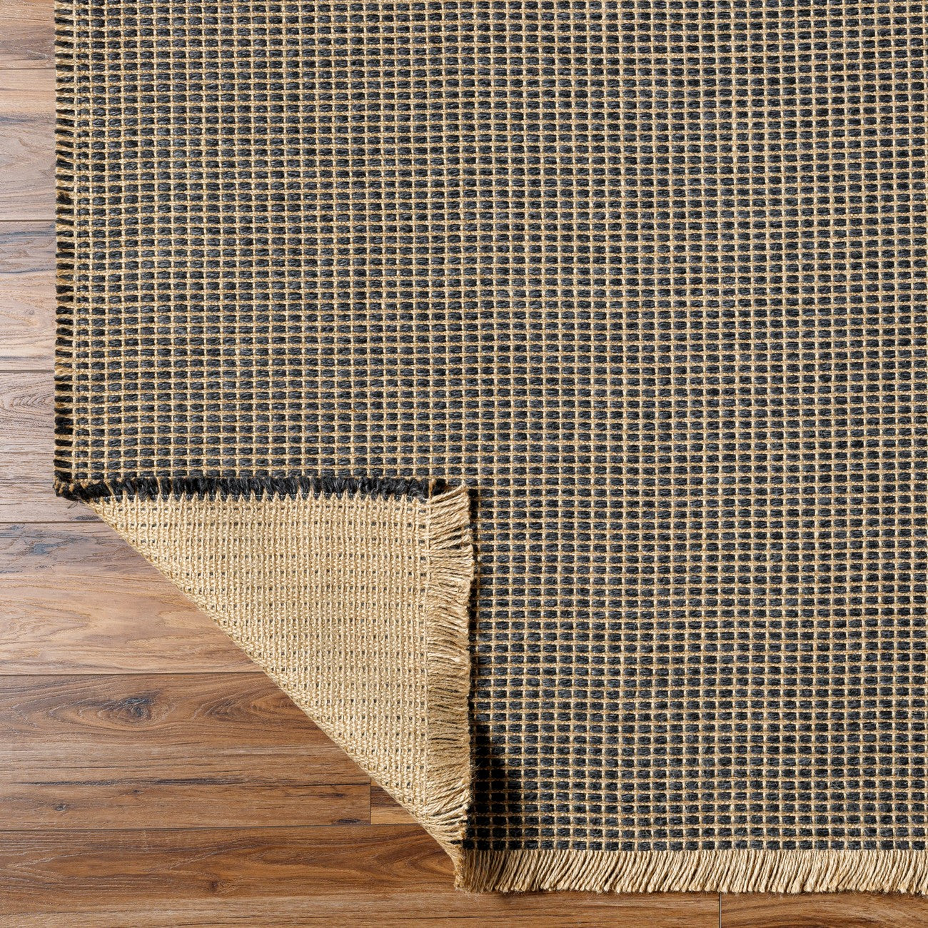 PAVI Becki Owens x Livabliss Solid and Border Charcoal Jute Area Rug Fold