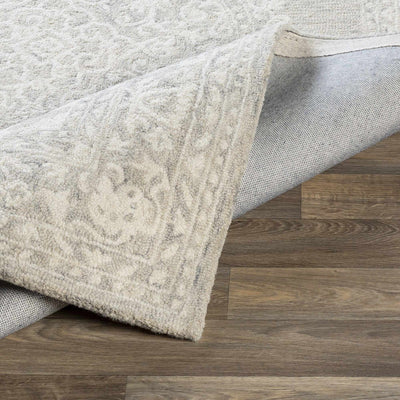 Roessleville Cream Wool Area Rug